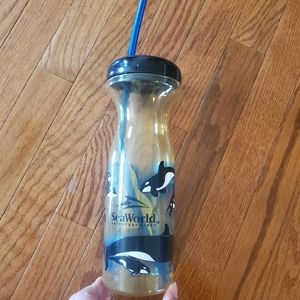 Vintage SeaWorld reusable plastic cup with blue straw